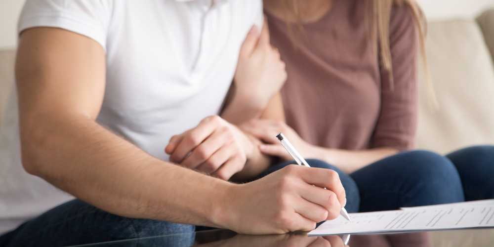 Mortgages Plymouth - Couple Signing Document - Plymouth Homes Mortgages Plymouth - Couple Signing Document - Plymouth Homes