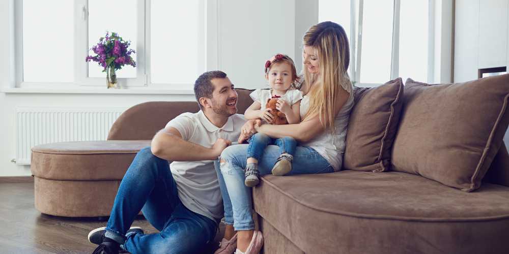 Renting a Property Plymouth - Family Sitting on a Sofa - Plymouth Homes