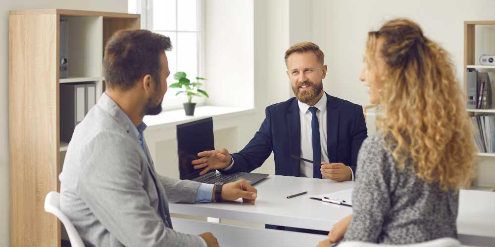 Solicitors Plymouth - Couple Discussing House Purchase with a Solicitor - Plymouth Homes